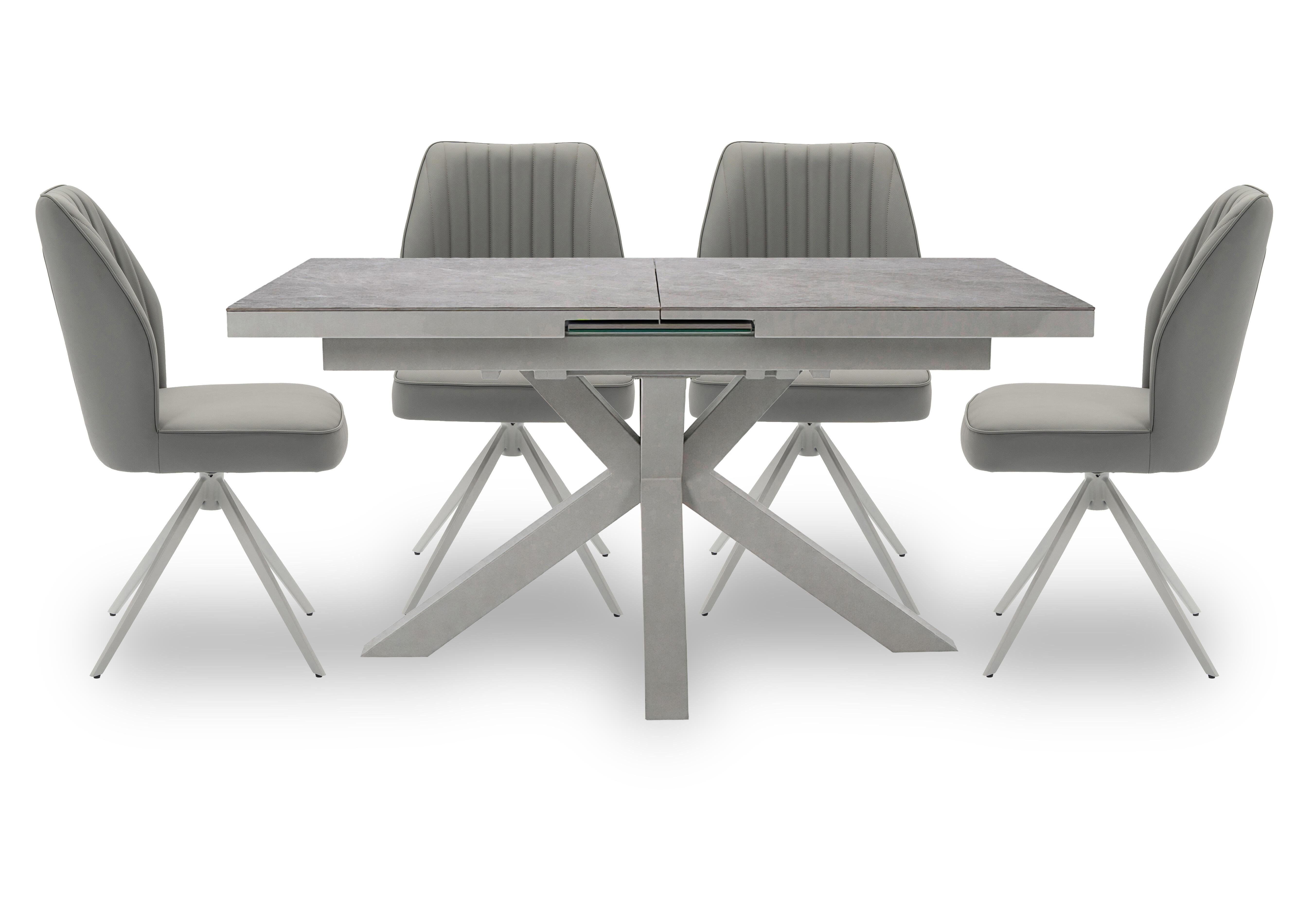 Fumo Pop Up Extending Dining Table and 4 Faux Leather Swivel Dining Chairs in  on Furniture Village