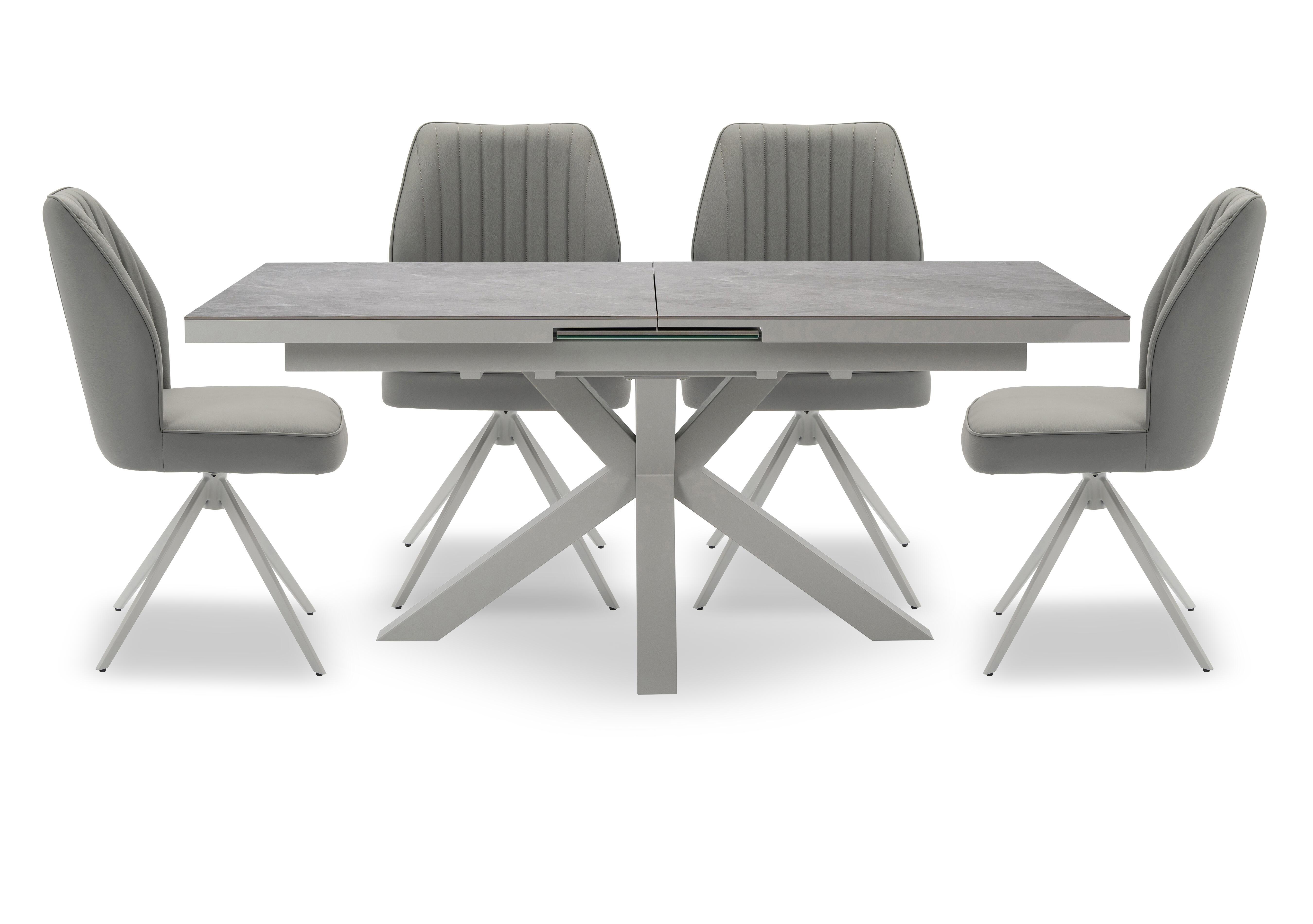 Fumo Pop Up Extending Dining Table and 4 Faux Leather Swivel Dining Chairs in  on Furniture Village