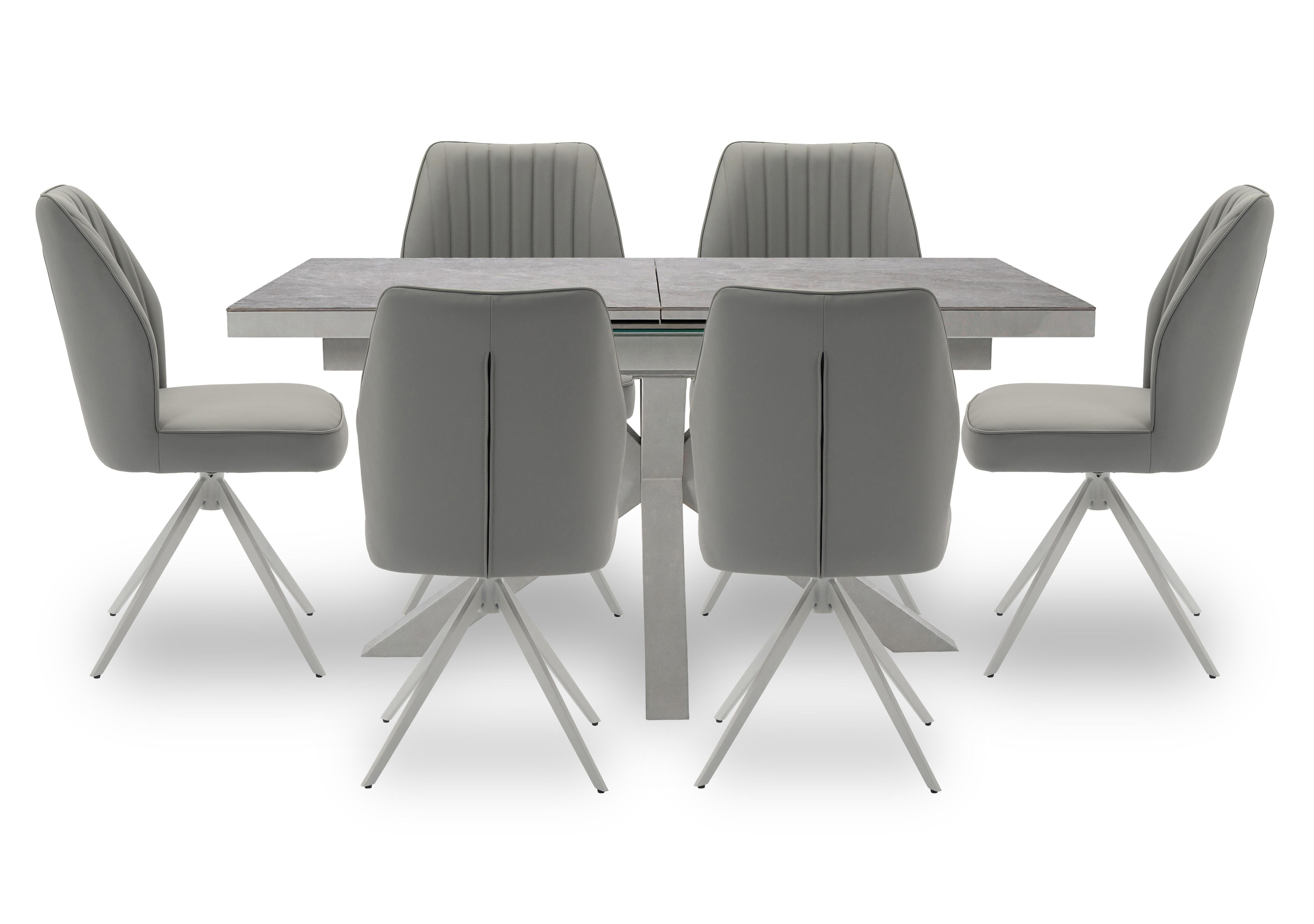 Fumo Pop Up Extending Dining Table and 6 Faux Leather Swivel Dining Chairs in  on Furniture Village