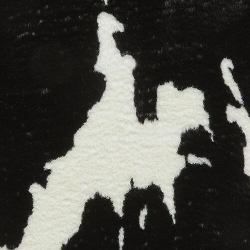 Faux Fur Cow Rug in Black - White on Furniture Village