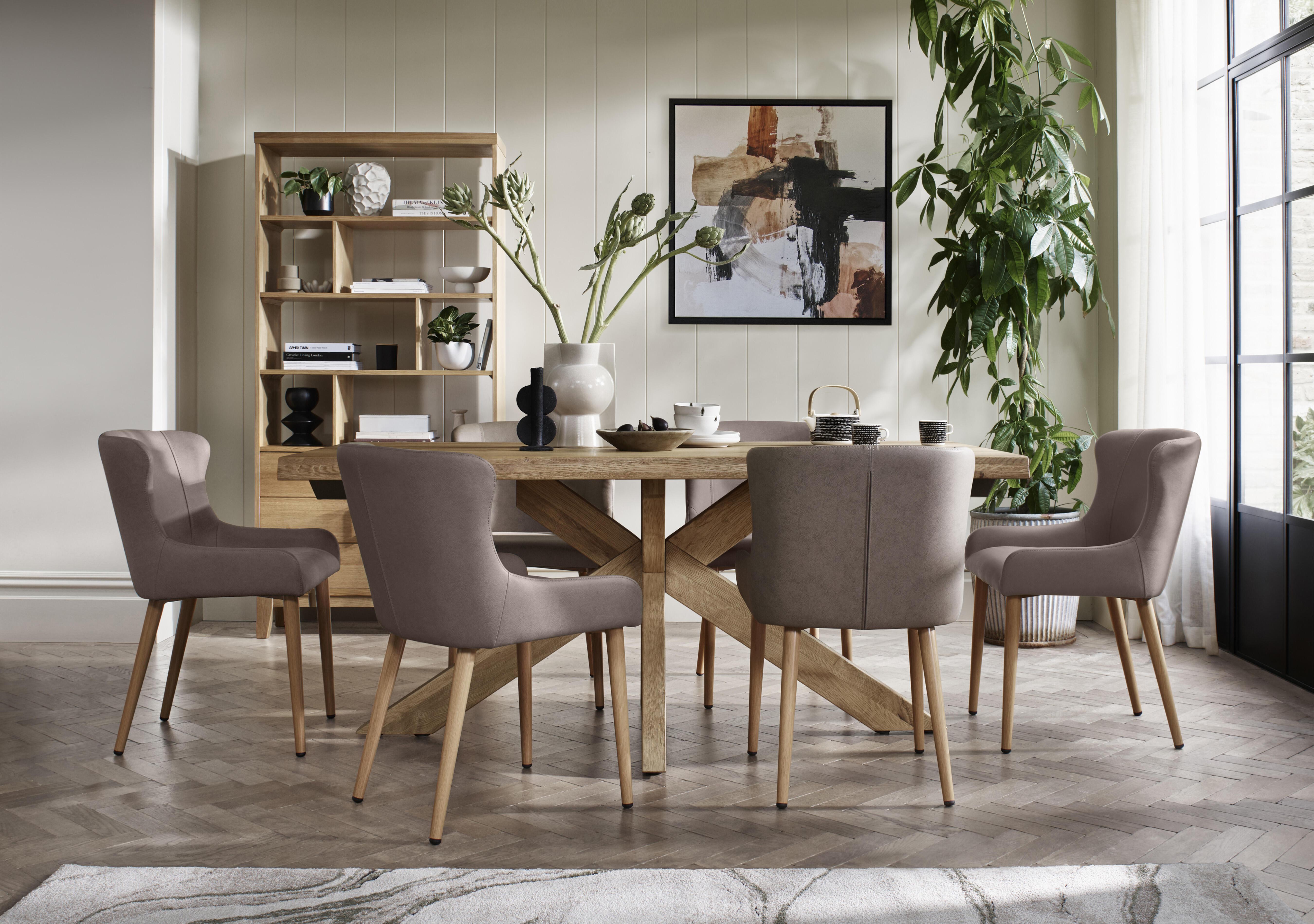 Riga Dining Table with Wooden Star Base and 6 Upholstered Dining Chairs in  on Furniture Village
