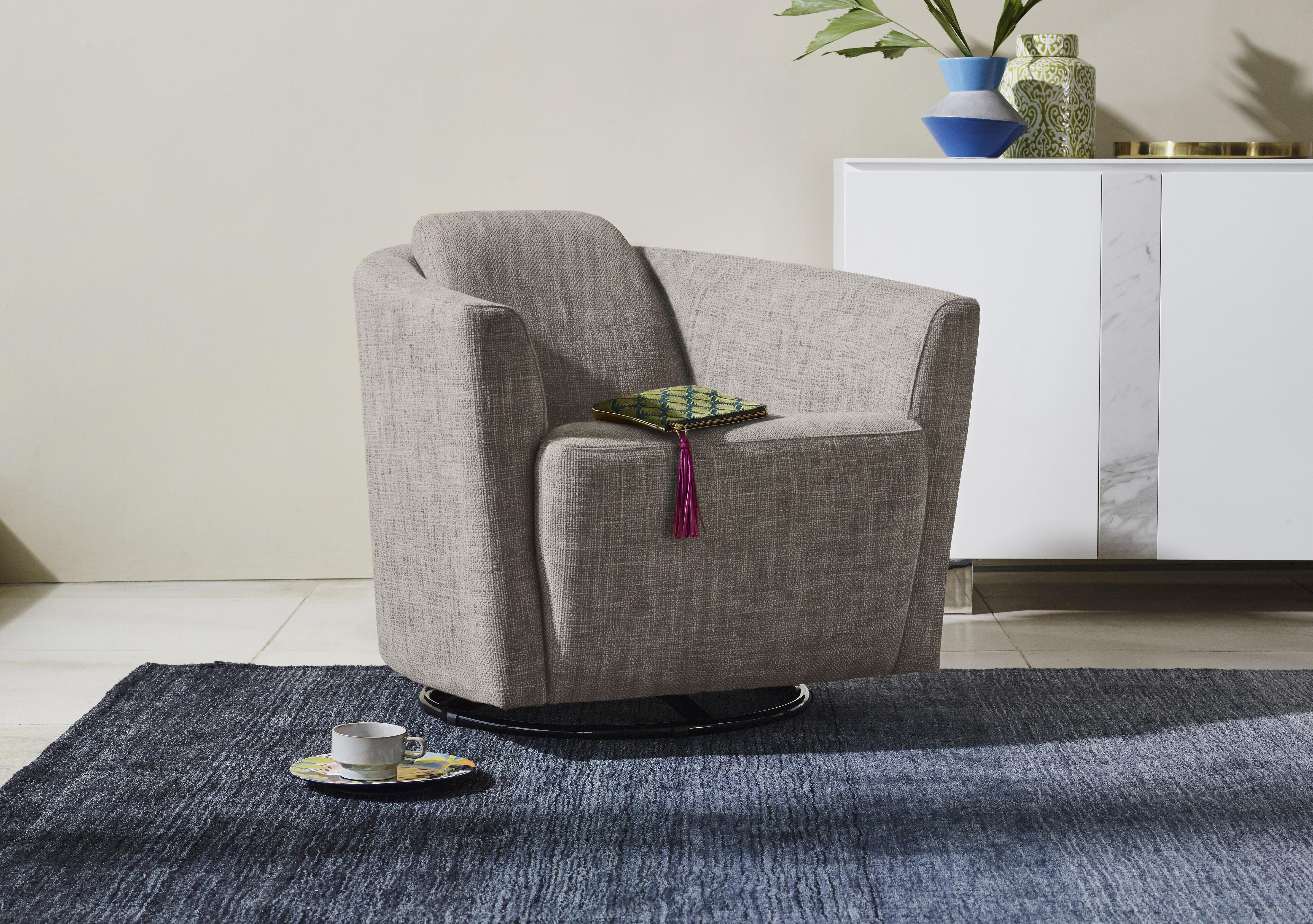 Ketty Fabric Swivel Accent Chair in  on Furniture Village